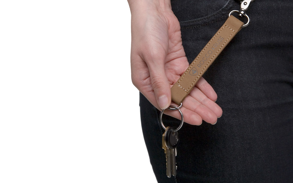Leather key fob and black jeans