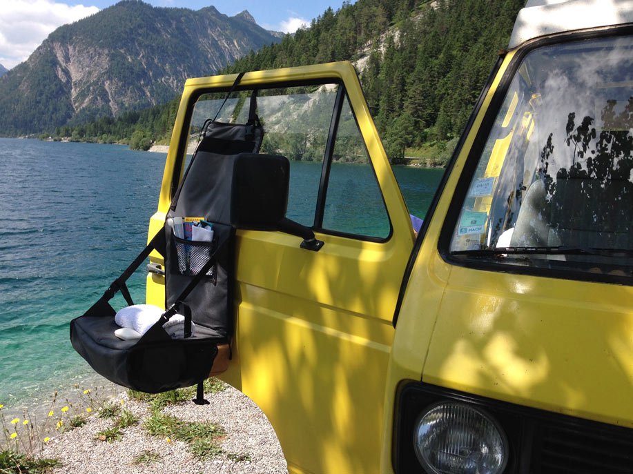 Camping wit Volkswagen bus and EVENaBAG toiletry bag at a mountain lake in USA